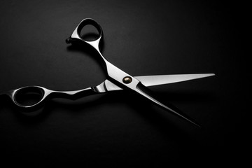professional scissors on black background