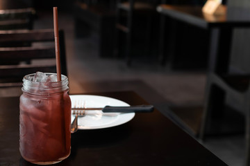 Juice with White plate on table
