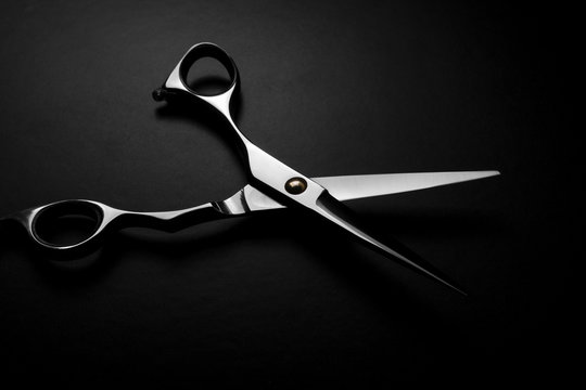 professional scissors on black background
