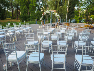 Wedding ceremony with flowers outside in the country garden