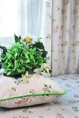  pillows with green flowers in the interior