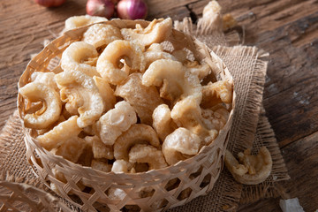 Pork rinds also known as chicharon or chicharrones , kab moo