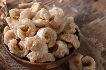 Pork rinds also known as chicharon or chicharrones , kab moo