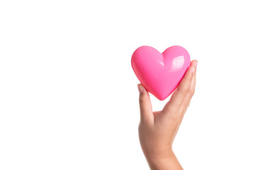Obraz premium Pink heart on kid hand isolated on white