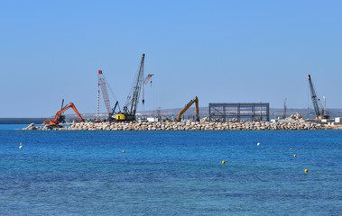 Fototapeta na wymiar Construction of pier on the sea coast