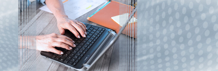 Female hands using a laptop. panoramic banner