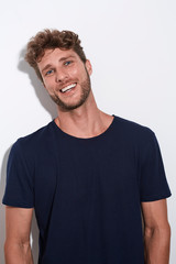 Fototapeta premium Laughing handsome guy in blue t-shirt