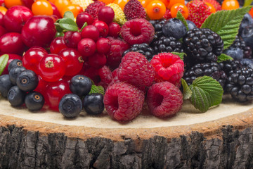 heap  of berries on wooden stub