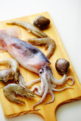 Various seafood on cutting board 