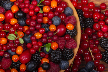 heap of berriers on wooden background