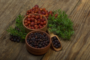 heap of red and black juniper berries background