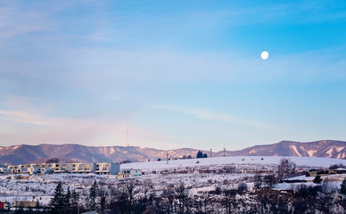 moon on the sky early in the morning in winter