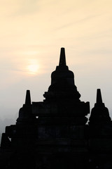 Silhouette Borobudur Temple with the mysteries forest surrounding at dawn, Yogyakarta, Indonesia