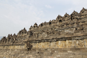 Naklejka premium Borobudur Temple with the Buddha statues during sunrise, Yogyakarta, Indonesia