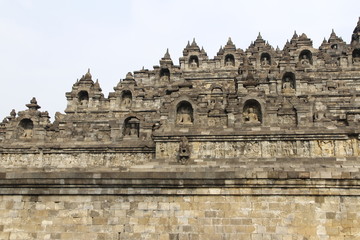 Fototapeta premium Borobudur Temple with the Buddha statues during sunrise, Yogyakarta, Indonesia