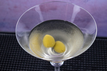 Dirty Martini cocktail in martini glass with olives