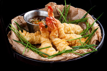 Tiger prawns in batter. Ebi tempura on dark background