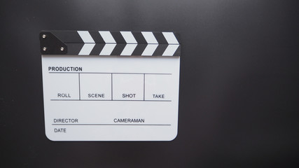 Fototapeta na wymiar White Clapperboard or clap board or movie slate use in video production ,film, cinema industry on black background.