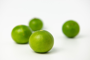 Limes with slices isolated on white background