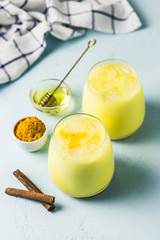 Iced turmeric latte. Selective focus, space for text.