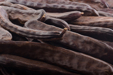 fresh carob pods background