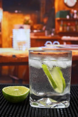 Gin and Tonic Cocktail in old fashioned glass with lime and ice