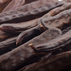 fresh carob pods background