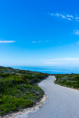 Greece, Zakynthos, Stunning curved street to the blue ocean