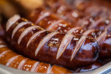 Delicious grilled sausages. Street festival food. Close-up