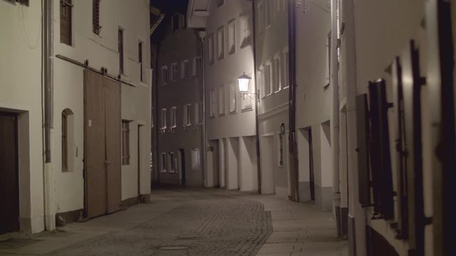 Old European narrow empty street of a medieval town in the evening. Taken in Fussen, Germany