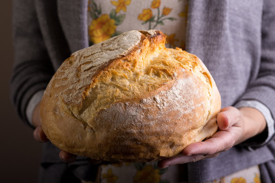 girl holding fresh white bread