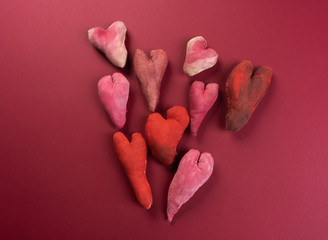 Handmade hearts on red background. Valentines day