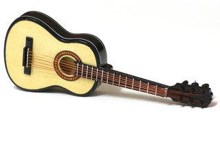 Obraz na płótnie Canvas Classical acoustic guitar on white isolated background, macro