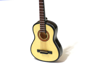 Obraz premium Classical acoustic guitar on white isolated background, macro