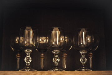 Wine glasses on a wooden background.