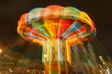 Fototapeta na wymiar Carousel lights and movements, long exposure photography