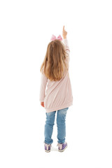 Back view of little girl points at wall. Rear view. Isolated on white background 