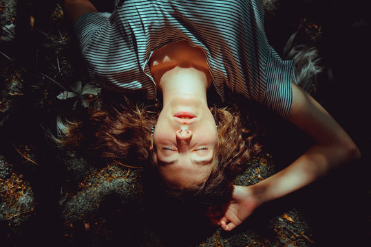 Woman lying on ground