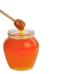 jar with honey with wooden spoon  isolated on white background