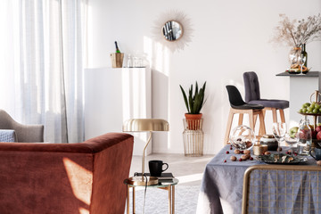 Elegant living and dining room interior with fashionable furniture