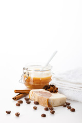 Handmade soap on a white background. Means for skin care with the aroma of honey, coffee, cinnamon and badian. Spa treatments and aromatherapy for smooth and healthy skin.