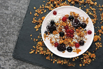 Healthy breakfast bowl with yogurt, granola and berries. Keto diet. Concept proper breakfast. Flat Lay.