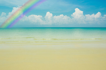 blue sea with blue sky with rainbow background