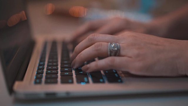 Woman Typing on Laptop Depth of Field Light Bokeh 4k ProRes - Powered by Adobe