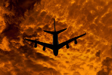 silhouette of airplane on fire background