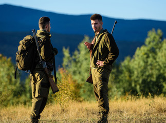 Friendship of men hunters. Military uniform fashion. Army forces. Camouflage. Hunting skills and...