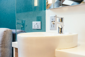 White sink and faucet decoration in bathroom