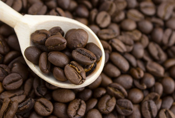 Roasted brown coffee beans, can be used as a background and texture