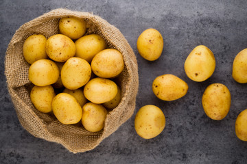 A bio russet potato wooden vintage background.