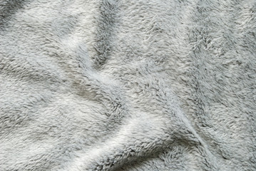 Close up white shaggy artificial fur texture or carpet for background